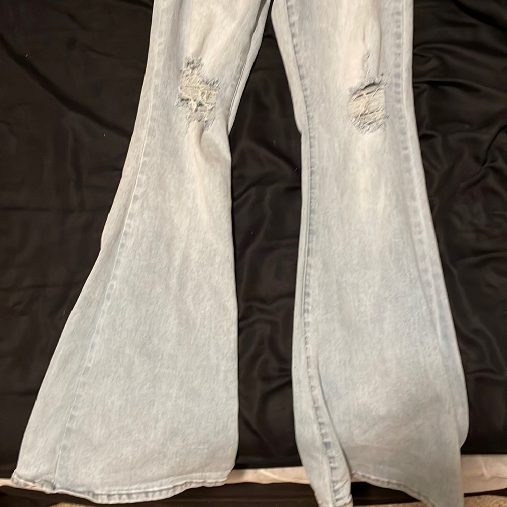 fit and flare jeans with rips at the knees